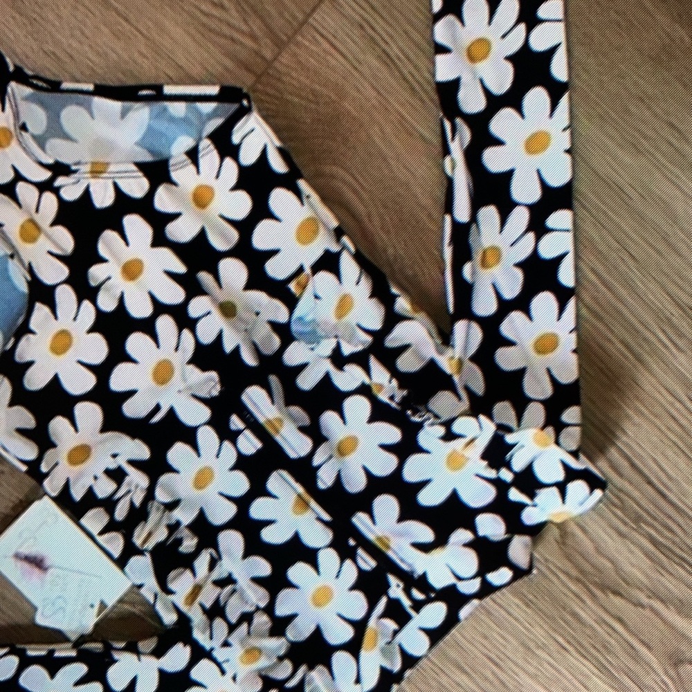 Cute ruffle detail and closure bottom one piece